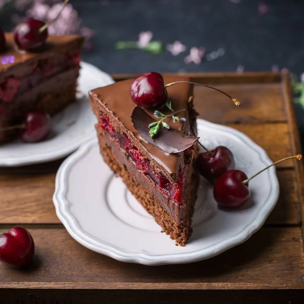 A piece of chocolate cherry mousse cake — Stock Photo, Image