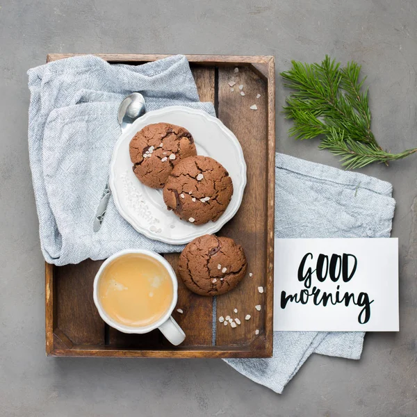 The perfect tasty breakfast!) Chocolate chip cookies with dark chocolate and sea pink Himalayan salt and cup of coffee on a gray concrete background. Best Brown Butter Cookies.
