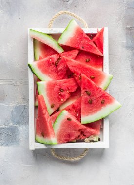  Summer time! Slices of fresh juicy red watermelon on a light white background Place for text. Flat lay, top view clipart
