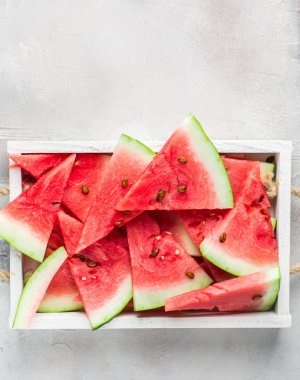  Summer time! Slices of fresh juicy red watermelon on a light white background Place for text. Flat lay, top view clipart