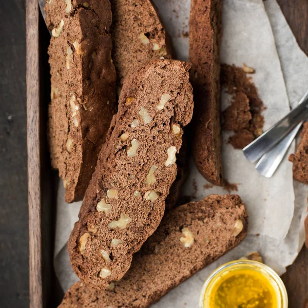 Classic chocolate Italian biscotti with nuts in a wooden vintage box. Copy Space. View blank space for text. Place for text. Food photo.  top view