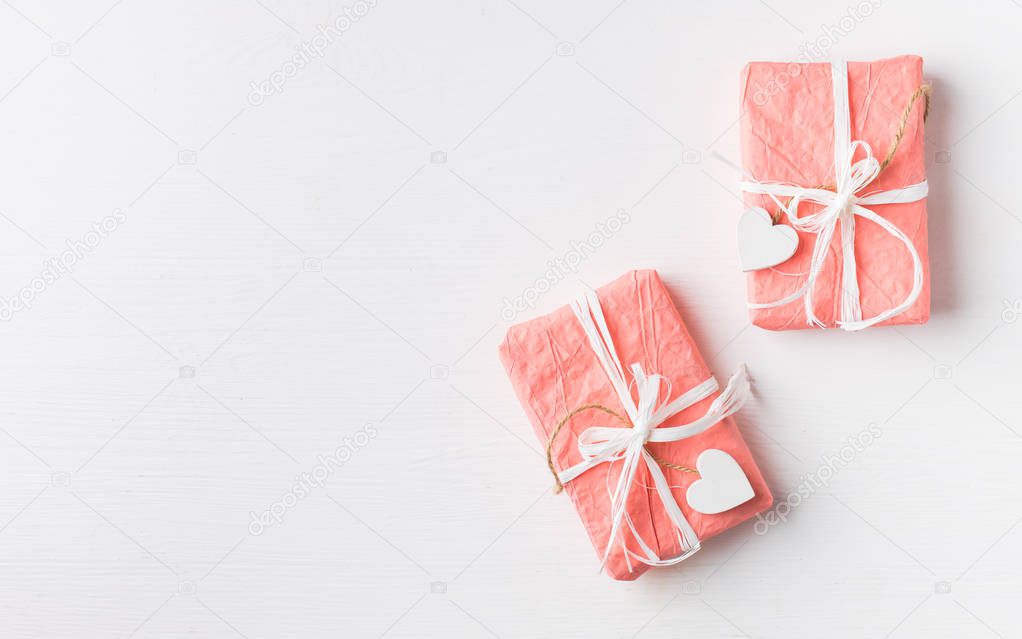 Gift boxes with ribbon and hearts on white wooden table.Beautiful Valentines day background.Romantic mood.) Flat lay