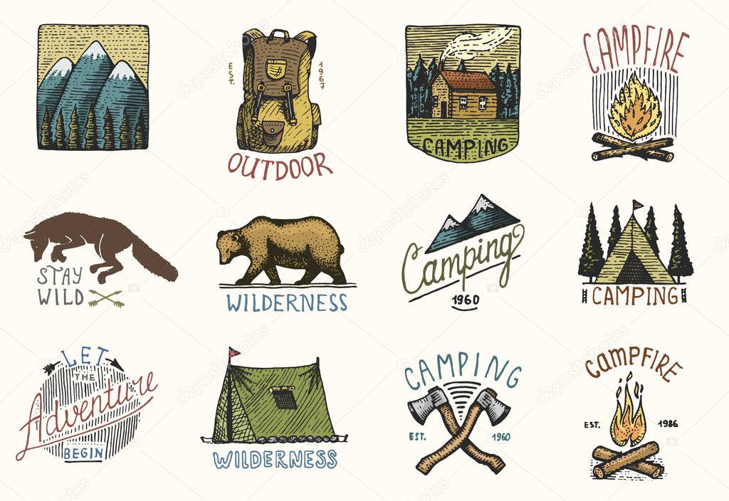 set of engraved vintage, hand drawn, old, labels or badges for camping, hiking, hunting with mountains, campfire and tent, axes. bear and backpack, wolf or red fox.