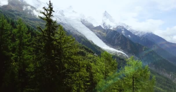 Alpine Mountain. Foggy landscape. Snowy peaks in Chamonix. Northern French and Swiss rustic scene. Panoramic aerial view of the valley. Pine forest. Footage for advertising and web. 4K drone shooting. — Stock Video