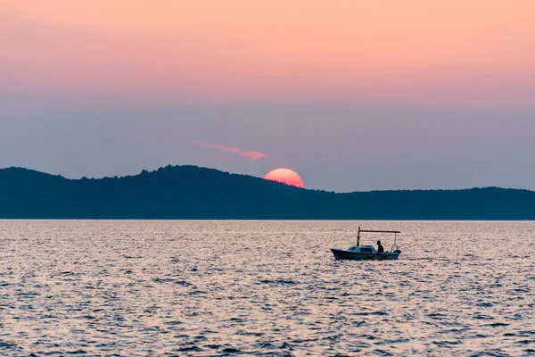 Sunset with boat — Stock Photo, Image