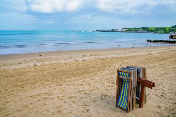 Deck chairs on swanage beach Royalty Free Stock Photos