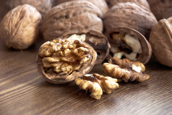 Walnuts on the wooden-table. — Stock Photo, Image