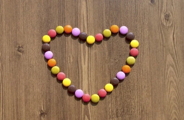 Coração feito de doces coloridos para bacgrounds — Fotografia de Stock