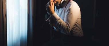 Elegant young handsome man wearing suit at studio fashion portrait