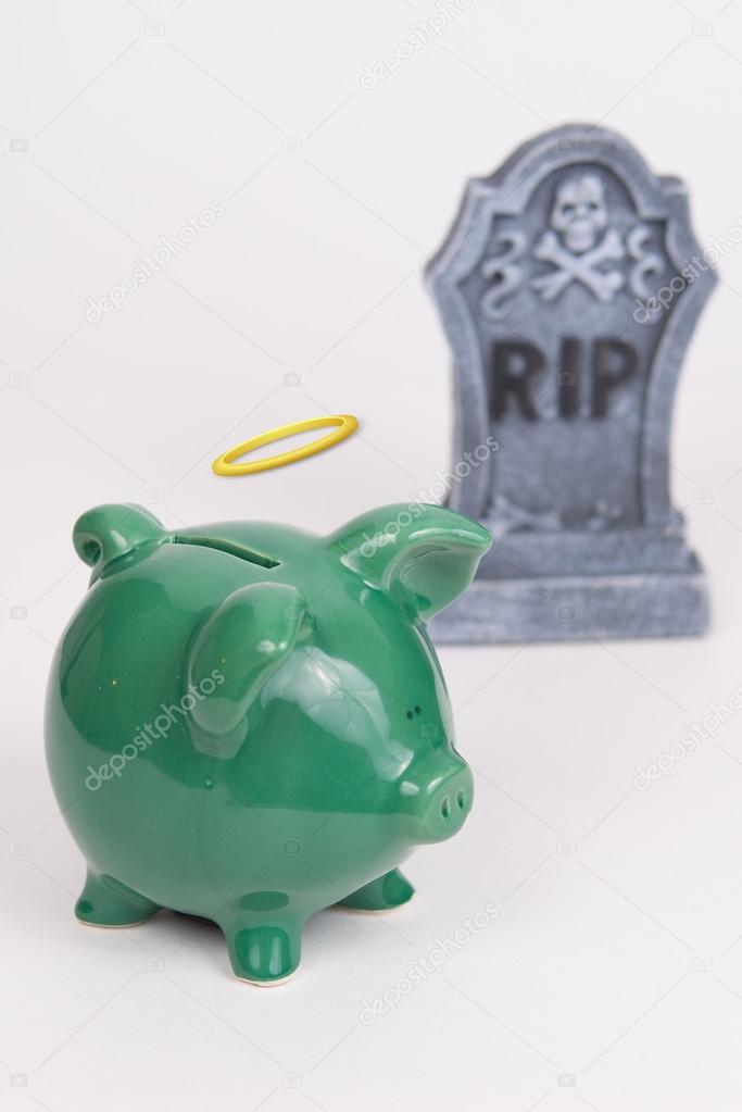Piggy bank with a Halo, white background , tombstone next to bank.