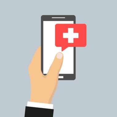 gri bir arka plan üzerinde el tıbbi yardım telefon