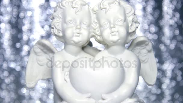 Plaster statuette of angels — Stock Video