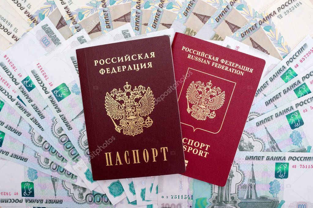  Russian passport, International passport and ruble  banknotes 