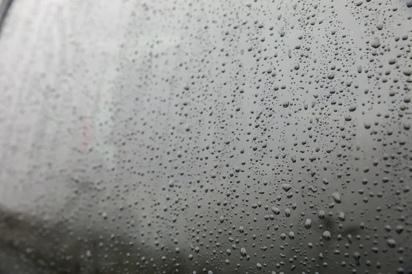 water droplets on car window glass