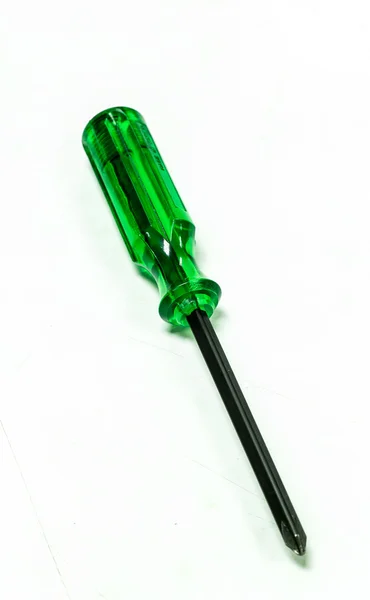 Green handle screwdriver on white background. — Stock Photo, Image