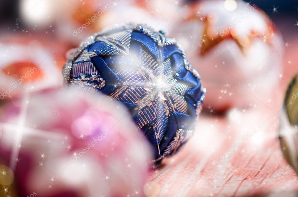 Christmas background, decoration. Christmas balls on a wooden table. Soft focus. Sparkles and bubbles. Abstract background. Vintage 