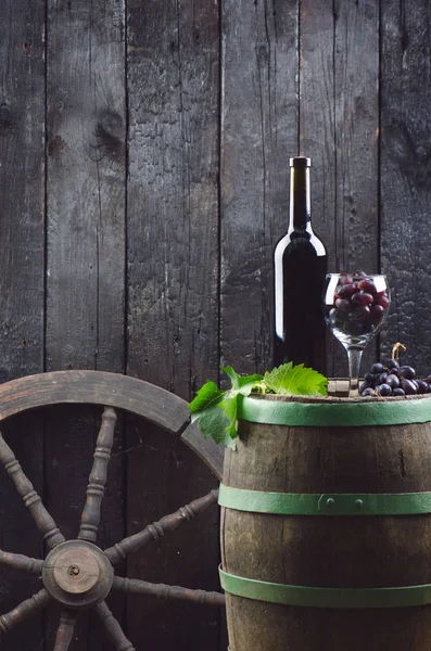 Glass Bottle Wine Next Wooden Barrel Burnt Black Wooden Background — ストック写真