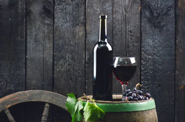 Glass Bottle Wine Next Wooden Barrel Burnt Black Wooden Background — ストック写真