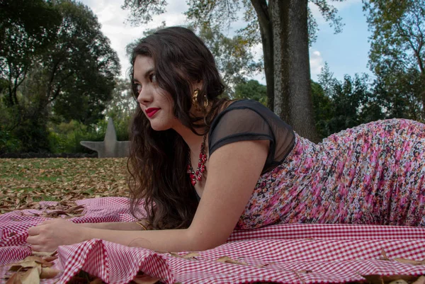 Gorgeous young latina relaxing in the park