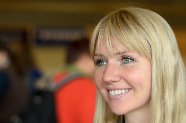 Attractive smiling young blond woman