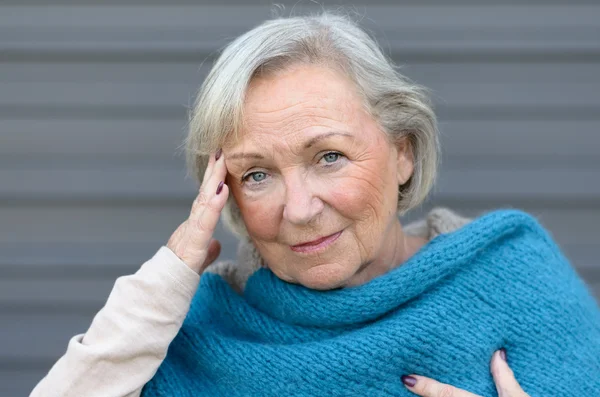 Elderly elegant woman with a headache — Stock Photo, Image