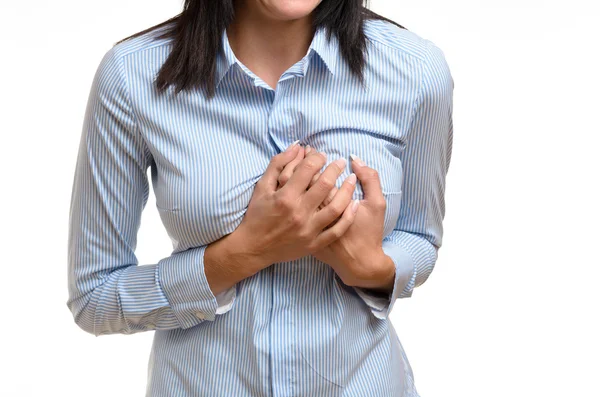 Woman clutching her breast in pain — Stockfoto