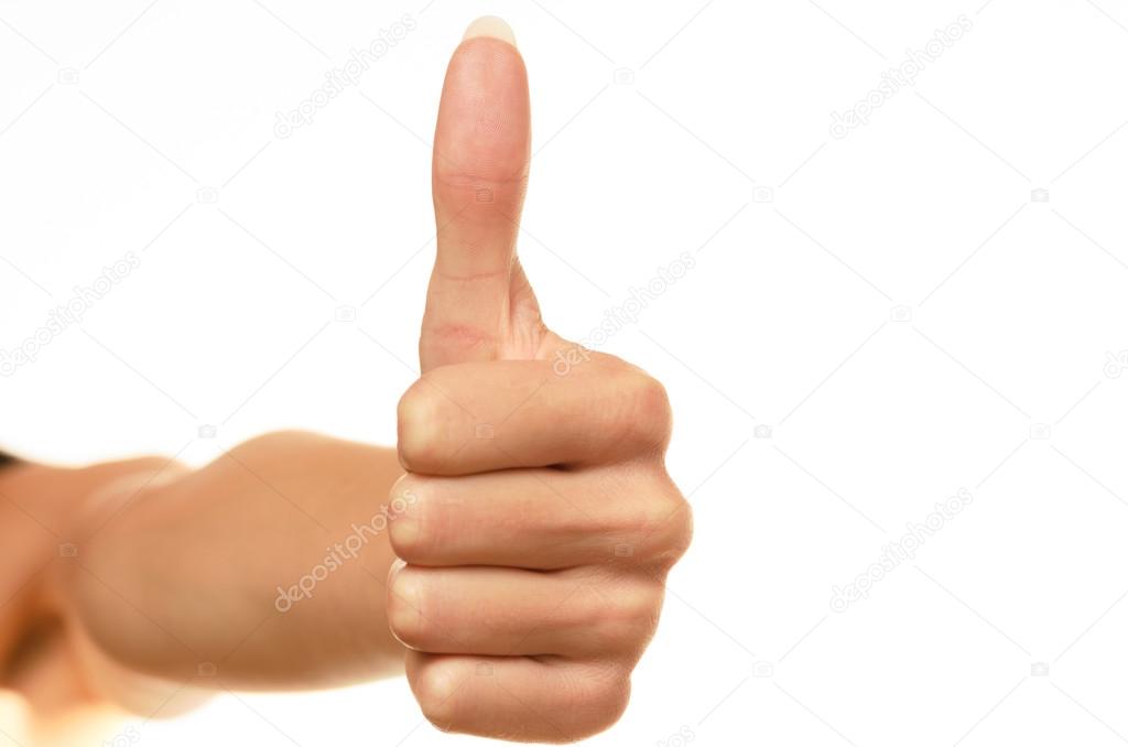 female hand showing thumbs up sign