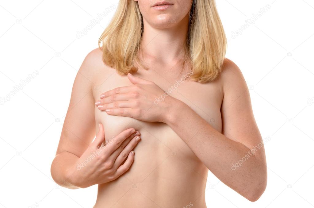 Nude young woman massaging her breast