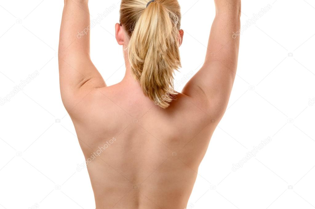 Back of a fit young woman with raised arms