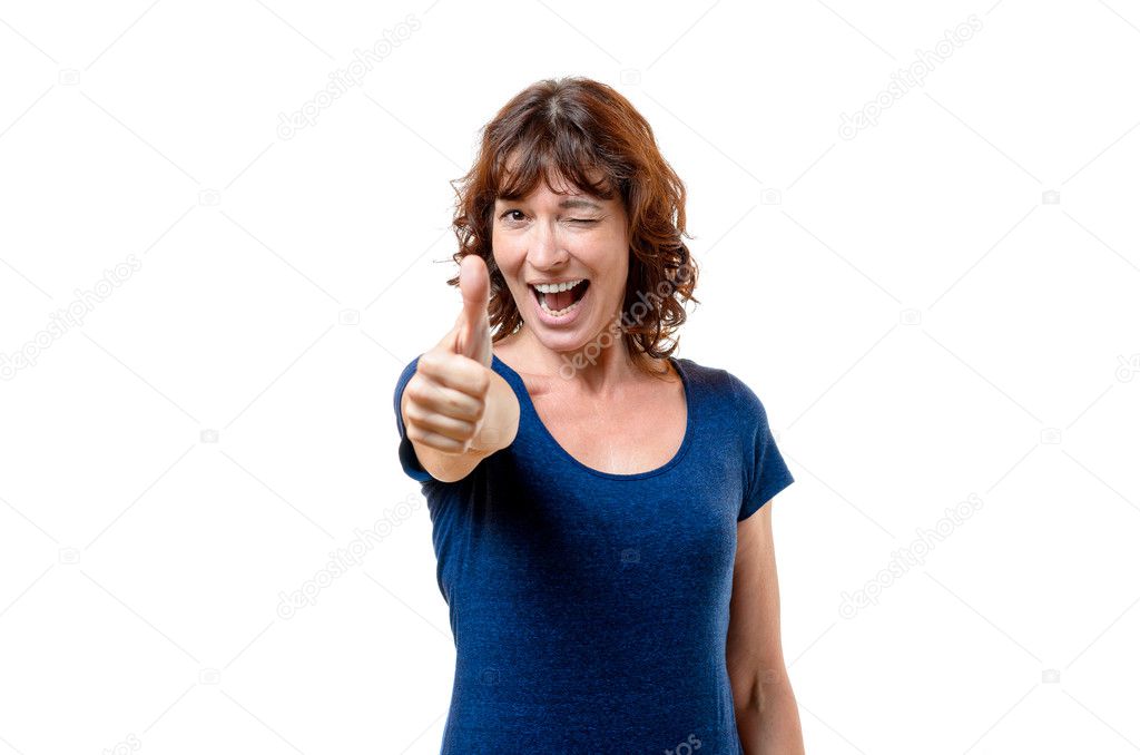 Happy woman winking and giving a thumbs up