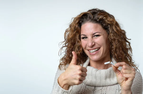 Cute woman giving a thumbs up gesture — Stock Photo, Image
