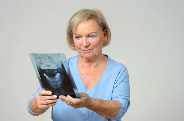 Elderly patient or doctor looking at an x-ray — Stock Photo, Image