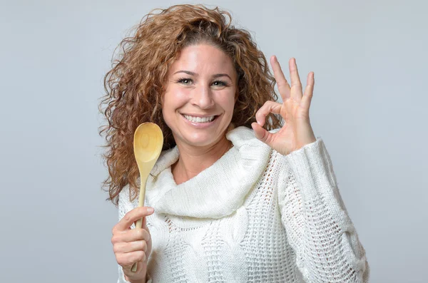Woman with a wooden spon — Stock Photo, Image