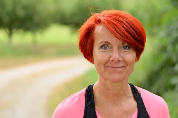 Beautiful happy middle-aged woman smiling — Stock Photo, Image