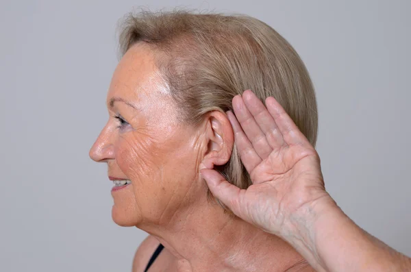 Elderly lady with hearing problems — Stock Photo, Image