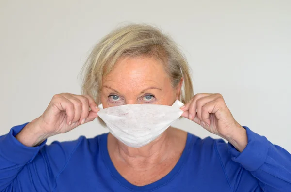 Woman with a surgical mask — Stock Photo, Image