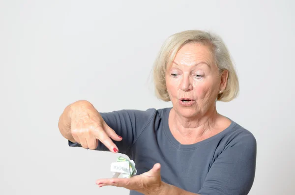 Senior Woman Showing Crumpled Money on Hand — Stock Photo, Image