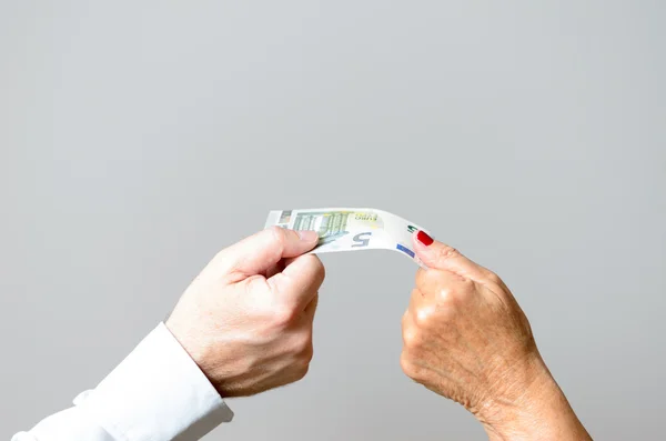 Conceptual Two Hands Holding Euro Bill in Close up — Stock Photo, Image