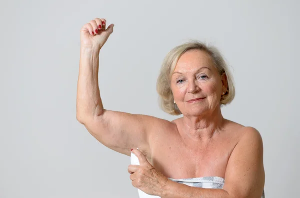 Middle Aged Lady Applying Deodorant on Armpit — Stock Photo, Image