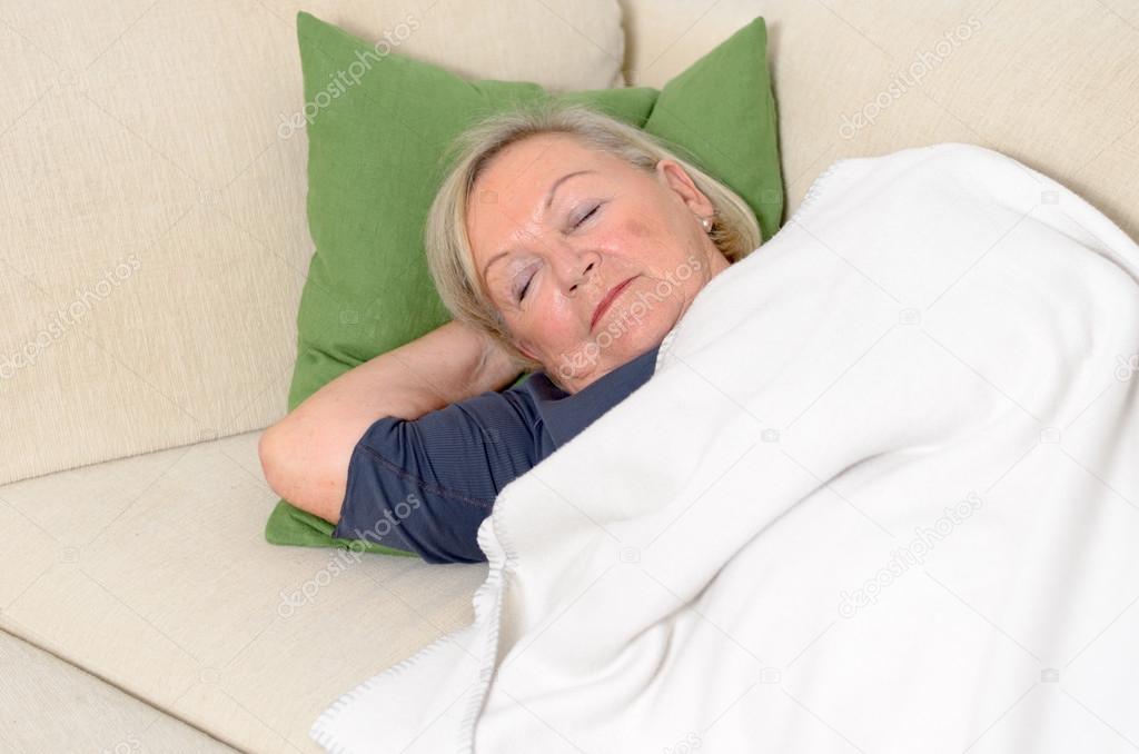 Close up Middle Aged Blond Woman Resting on Couch