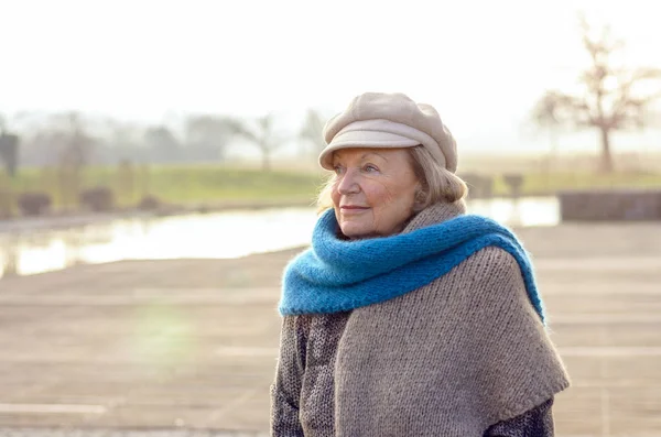 Chic senior woman in a winter beret and scarf — Stock Photo, Image