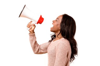 Angry young woman yelling into a megaphone clipart