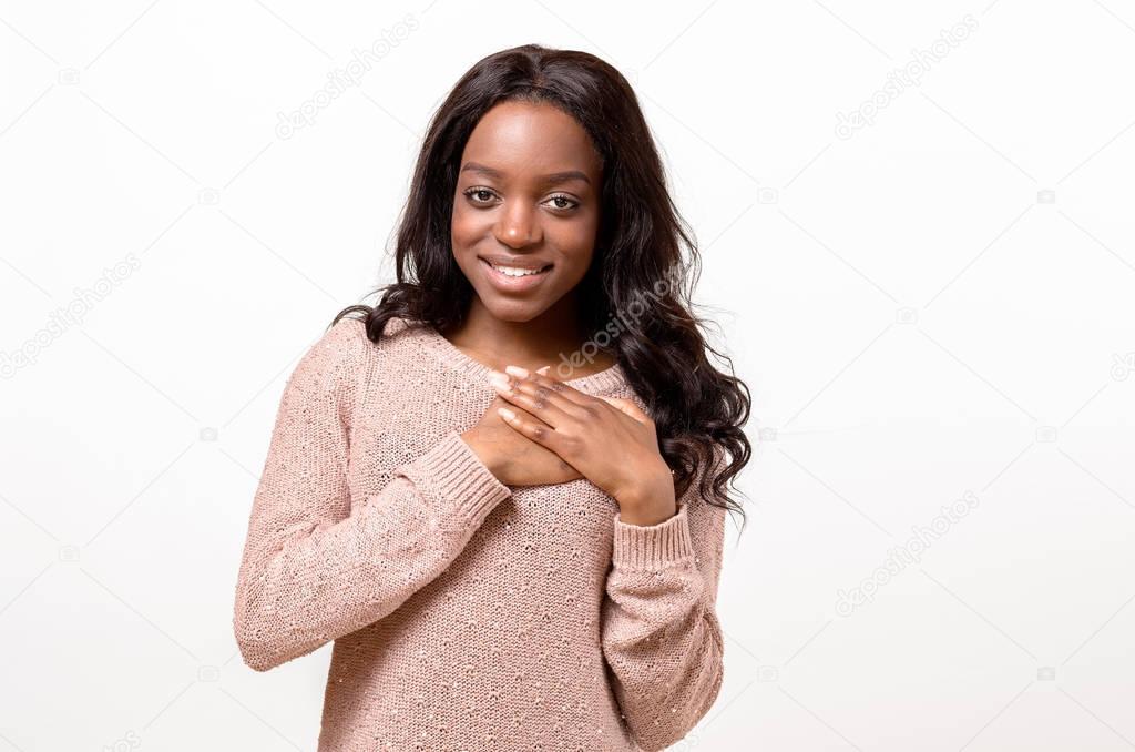 Young woman showing her heartfelt gratitude