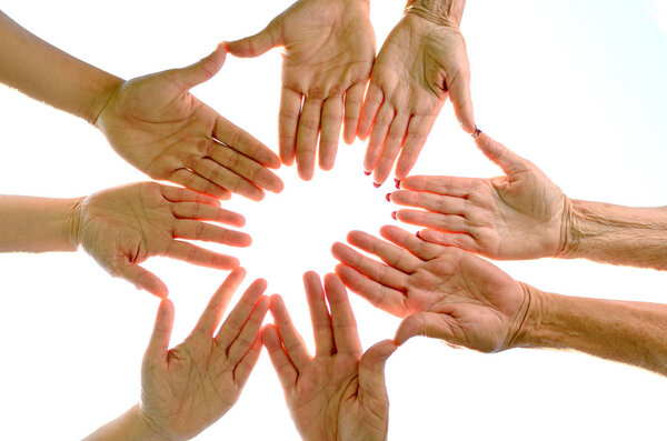 Team putting all hands together