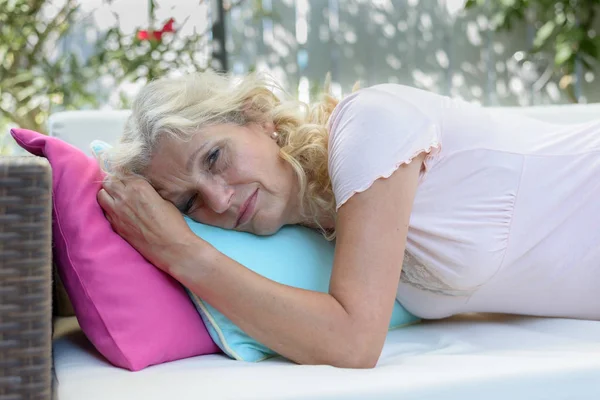 Exhausted or unwell senior woman taking a rest — Stock Photo, Image