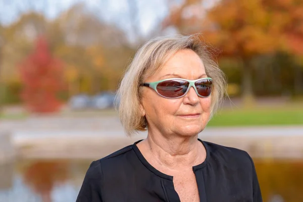 Senior woman wearing trendy modern sunglasses — Stock Photo, Image