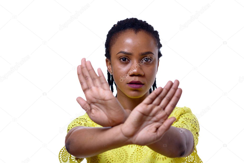 African American woman showing two hands stop gesture
