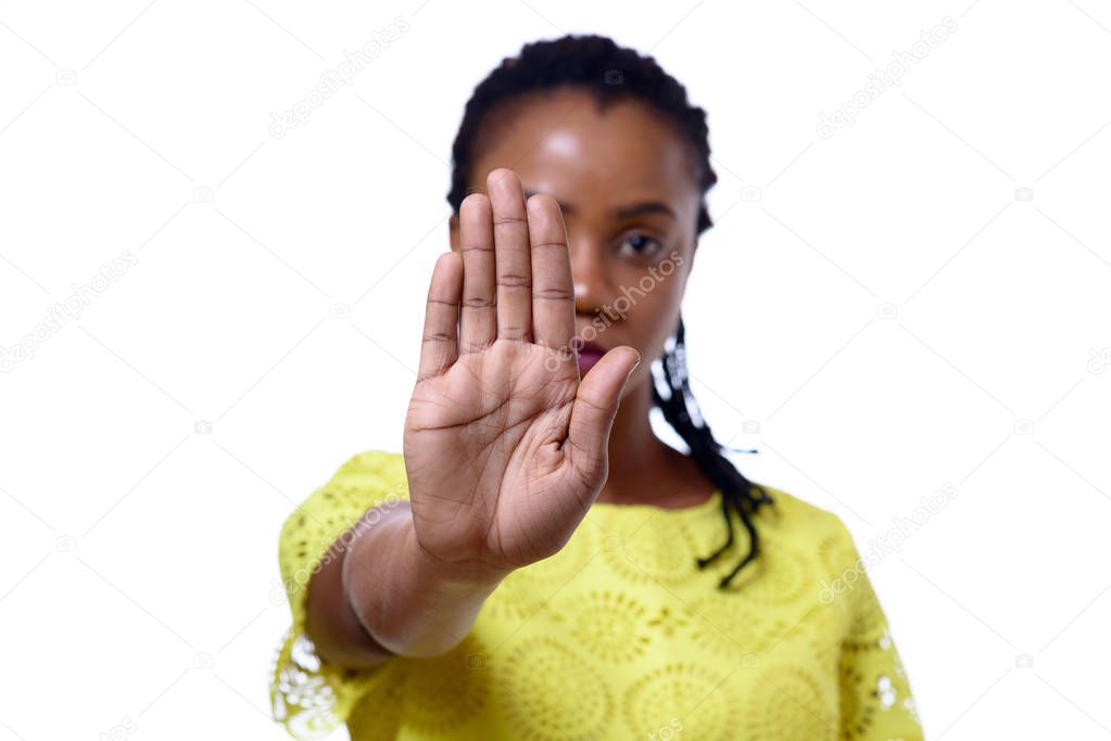 African American woman showing hand stop gesture