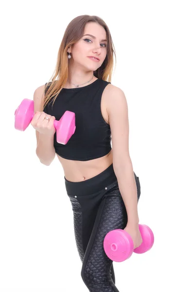 Diyet. Fitness. Genç güzel kız onun elinde pembe dumbbells ile. Kız spor egzersiz gerçekleştirir — Stok fotoğraf