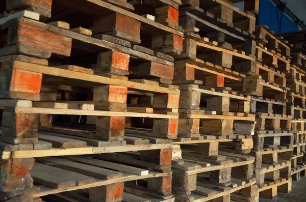 wooden pallets. wood texture. Pallets stacked in piles.